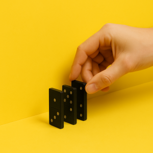 a hand holding dominoes