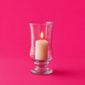 Deep work philosophies compared: which one actually fits your life - single lit candle protected by a glass hurricane shade outdoors