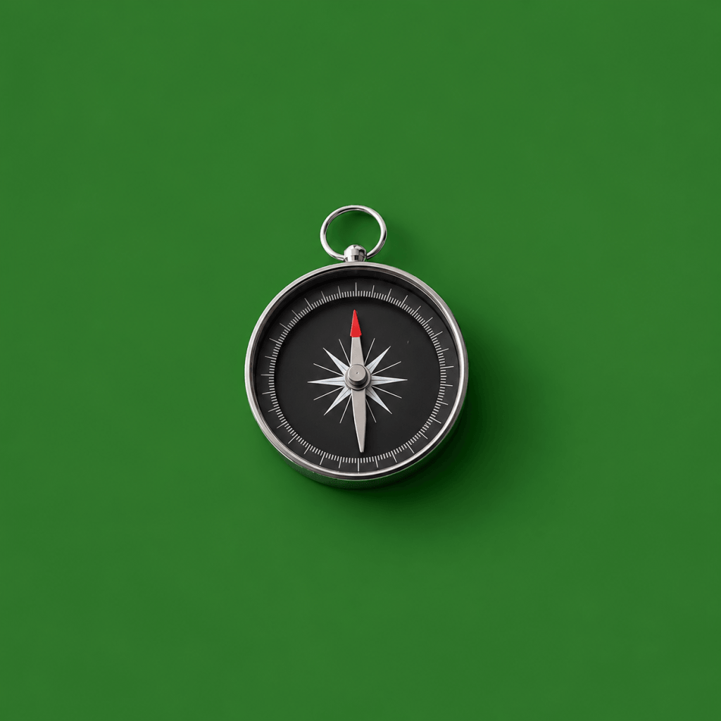 Goal Setting App + Framework: How to Set Effective Life Goals (2026) - single compass with the needle pointing at a marked destination